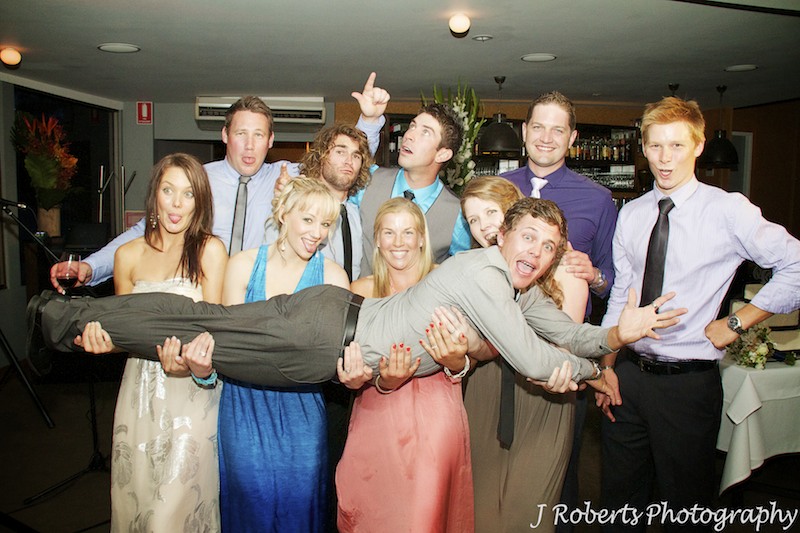 couples friends being silly at wedding reception - wedding photography sydney